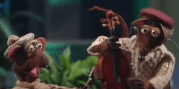 Two Muppet rats; the one on the right is playing an upright stringed instrument