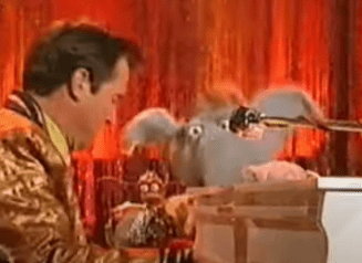 Left: Dennis Quaid in a gold jacket plays a white piano and sings into a microphone. Pepe and Seymour are in the background.